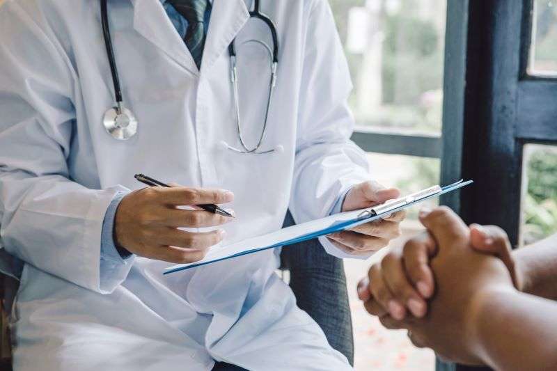 doctor talking with patient
