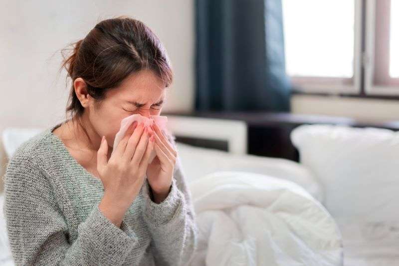 woman suffering nasal obstruction